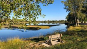 About Heaven's View Ministry - Testimonials - River Bank with Bench under Tree - NEBRASKA, USA